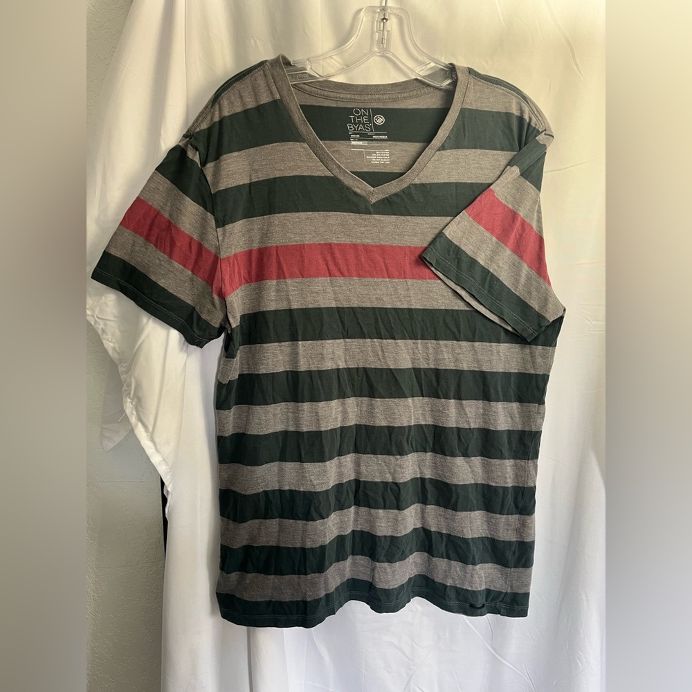On the Byas Men’s M one red stripe with green and gray stripes V-neck T-shirt.